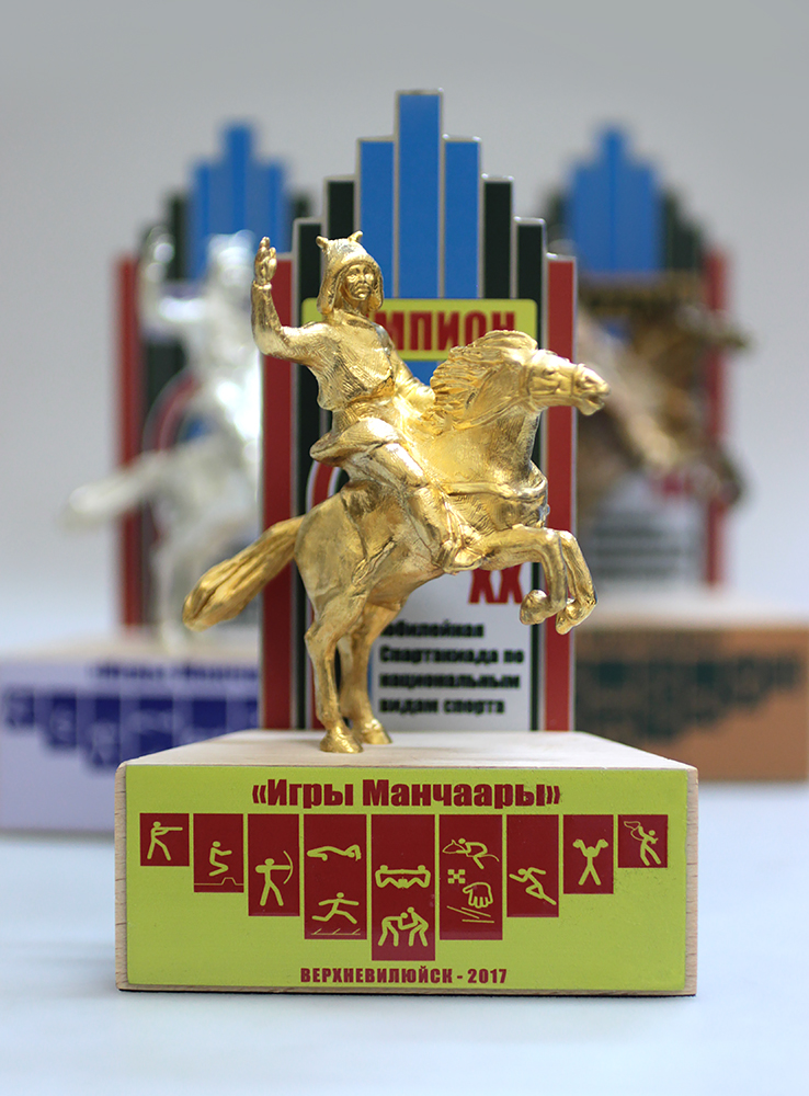 Игры манчаары. Памятник Манчаары. Медаль игры Манчаары.